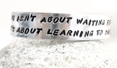 Life Is About... Learning to Dance in the Rain - Aluminum Handstamped 1/2” Bracelet